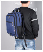 Male waterproof casual student backpack with USB charging port and laptop compartment